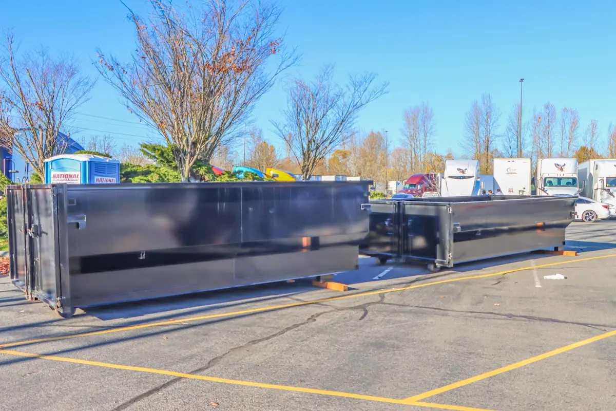 Professional dumpster rental service with roll-off container on residential driveway in Lake Zurich